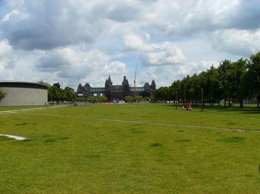 Amsterdam 1-Hour Rickshaw Tour - Canal houses and old streets from a low seat