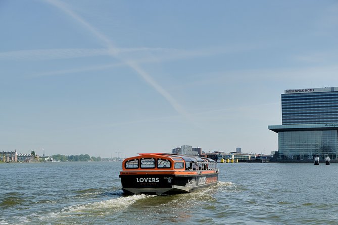 Amsterdam 1h Canal Cruise by Semi-Open Boat with Audio Guide - Magere Brug, Munt Tower, and the eastern canals