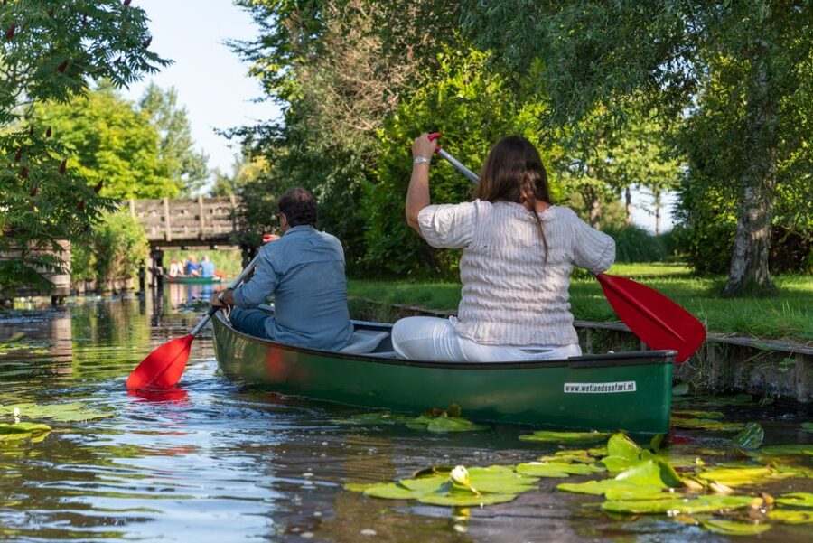 Amsterdam: 2-Hour Guided Canoe Trip - Paddling through the village canals