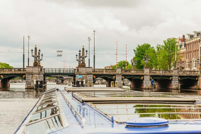 Amsterdam: 75 Minute City Canal Cruise with Audio Guide - Audio guide, captain, and seating