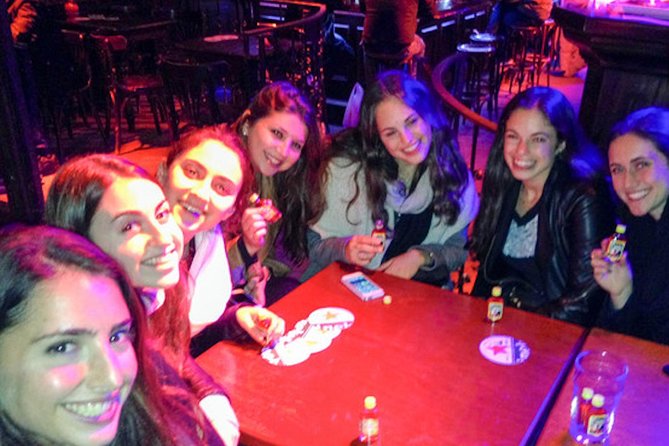 Amsterdam After Dark: Public Red Light District Exploration - Narrow streets, bars, and a reserved table