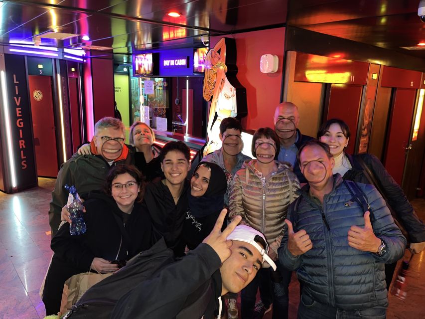 Amsterdam: After Dark Red Light District Tour - Timing, language, and cancellation