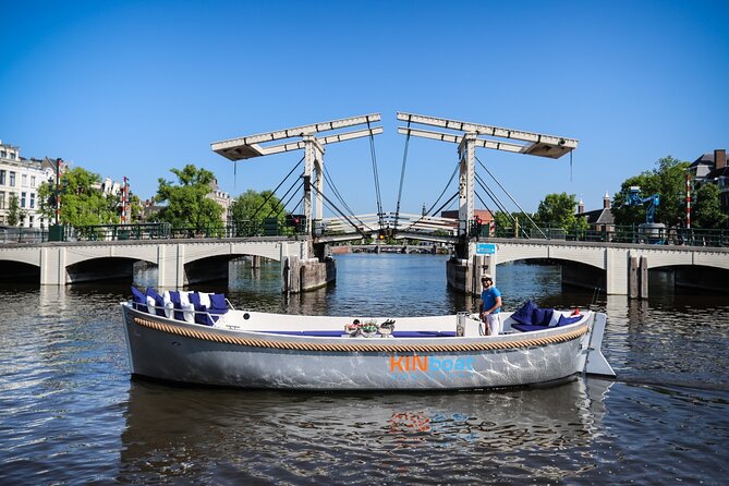 Amsterdam Canal Cruise in Open Boat with Unlimited Drinks Option - Bridges and canal houses provide constant photo chances