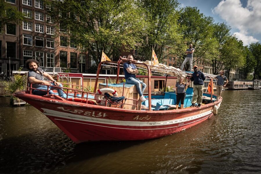 Amsterdam: Canal Cruise on a Wooden Refugee Boat - Meeting the Guides Behind the Stories