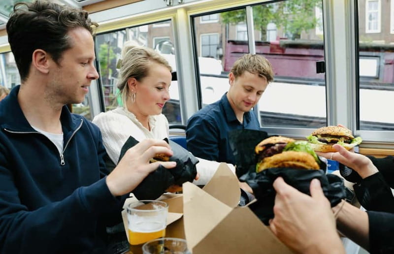Amsterdam canal cruise with culinary burger or cheese & wine - What the host and skipper add