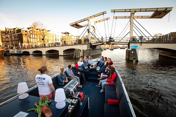 Amsterdam Canal Cruise With Live Guide and Unlimited Drinks - Unlimited drinks and onboard comfort
