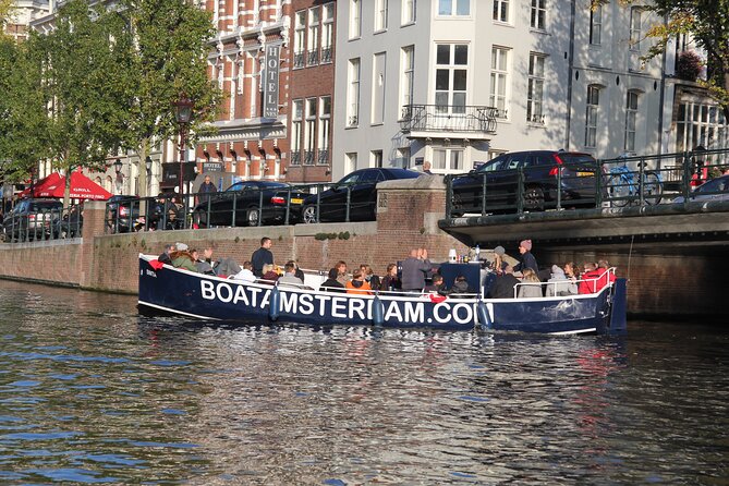 Amsterdam Canal Cruise with Open Bar - Central Station - The old harbor, Montelbaanstoren, and Waterlooplein