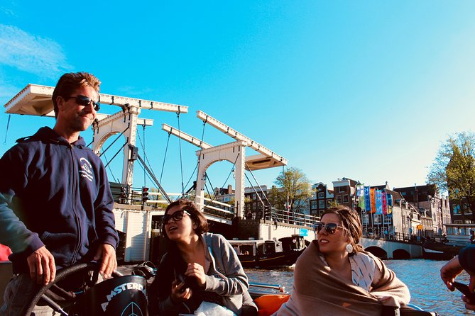 Amsterdam Canal Tour by Open Boat – 90 min Small Group Experience - Why a small open boat changes the experience