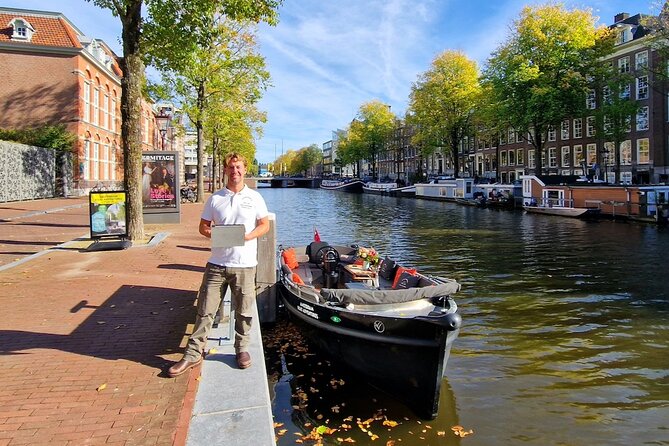 Amsterdam Canal Tour by Open Boat – 90 min Small Group Experience - Comfort in cool and unsettled weather
