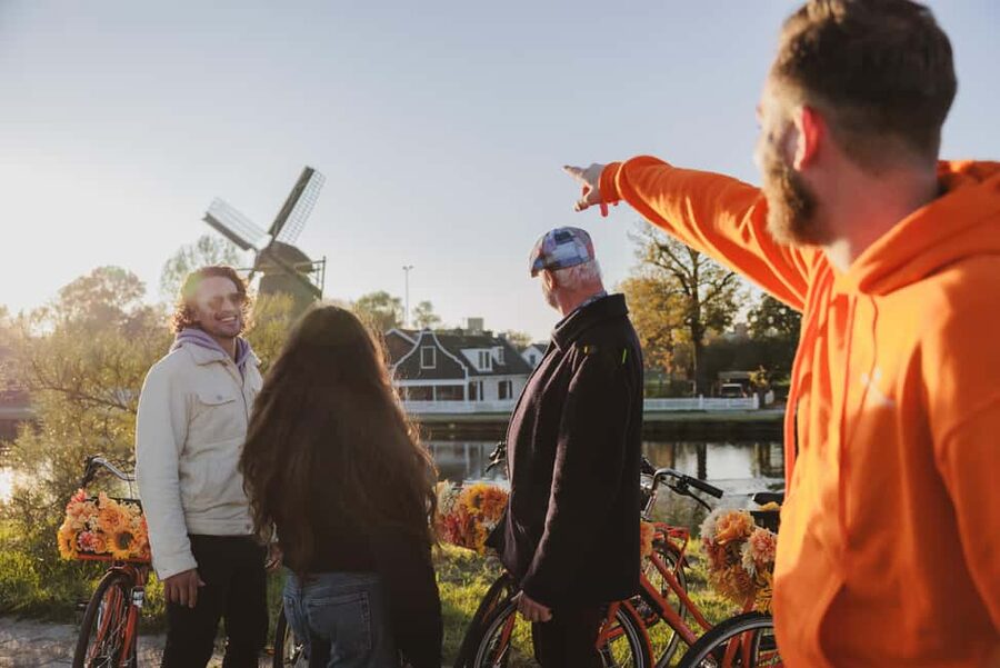 Amsterdam: Cheese, Windmill & Countryside Bike Tour - Leaving Amsterdam by ferry and bike