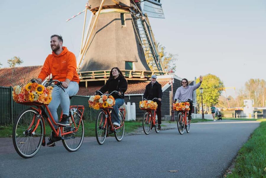 Amsterdam: Cheese, Windmill & Countryside Bike Tour - A windmill, canals, and polder roads