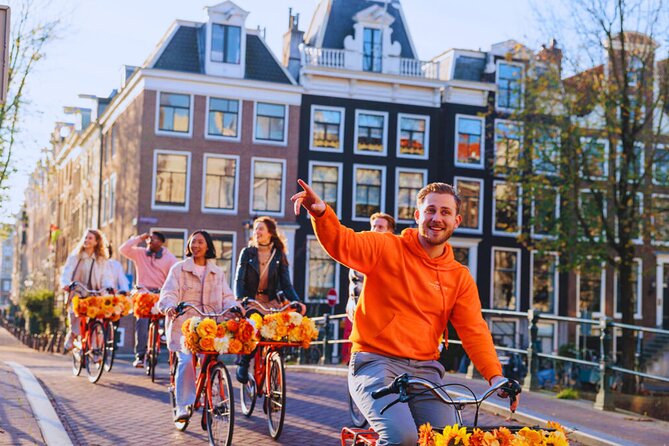 Amsterdam City Top Highlights Guided Bike Tour - Meeting your guide near Nieuwezijds Voorburgwal