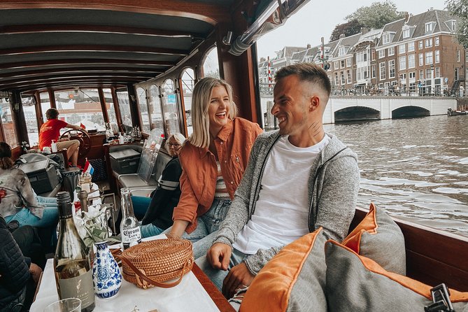 Amsterdam Classic Saloon Boat Cruise with Drinks and Cheese - Rijksmuseum, Magere Brug, and Munttoren