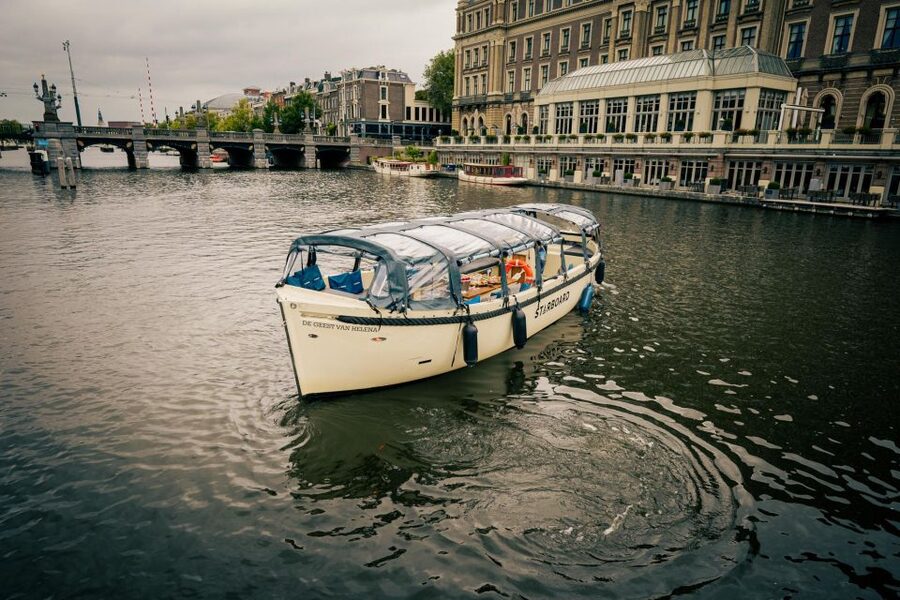 Amsterdam: Covered Canal Booze Cruise with Unlimited Drinks - The boat, cover, blankets, and group size