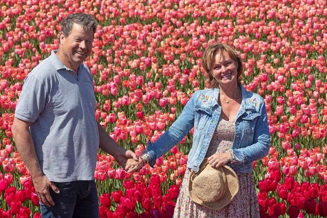 Amsterdam: Day trip to Tulip Farm, Keukenhof + Windmill Cruise - Passing the bulb fields near Lisse