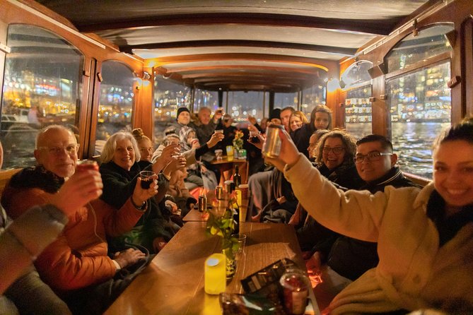 Amsterdam Evening Canal Cruise with Live Guide and Onboard Bar - Live guides, drinks, and the onboard atmosphere