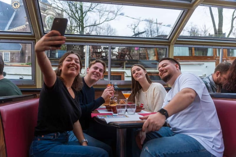 Amsterdam: Evening Cocktail Cruise along the canals - The panoramic boat and the seating tradeoff