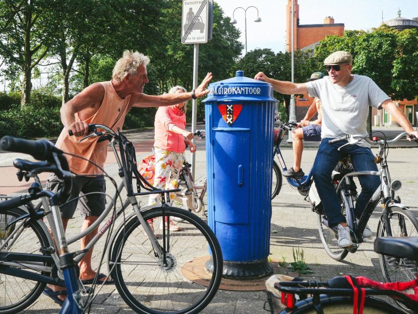 Amsterdam: Explore the City Highlights by Bike - Following Amsterdam’s canals and leaning houses