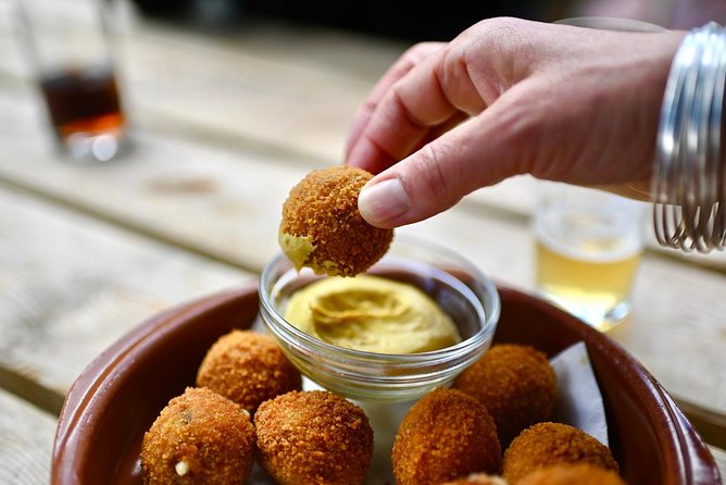 Amsterdam Food Tour of 10+ Local Classic Tastings in Jordaan Area - The fishmonger stop is the most distinctive taste