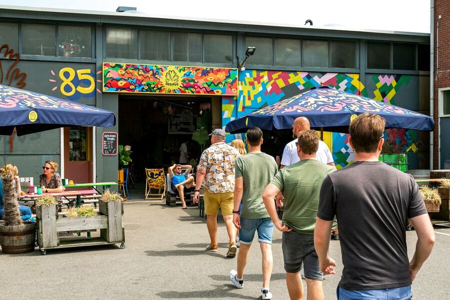 Amsterdam: Guided Craft Beer Brewery Bus Tour with Tastings - Meeting the yellow-shirted guide at Overhoeksplein