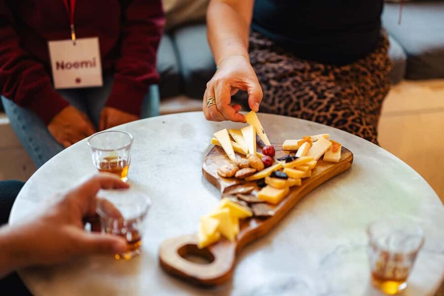 Amsterdam: Guided Cultural Food Tour in German or English - Damrak and Beurs van Berlage: trade, water, and grand architecture