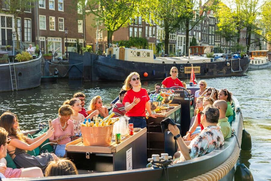Amsterdam: Guided Open Boat Canal Cruise Including Drink - Along the Amstel and through the historic center