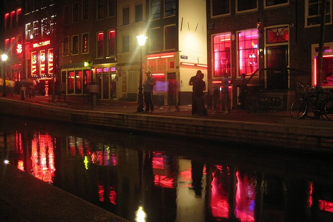 Amsterdam: Guided Red Light District and City Walking Tour - The smallest house and the practical side of trade