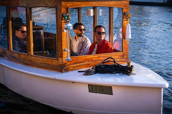 Amsterdam Highlights Canal Cruise with a Drink - Old Town architecture from the water