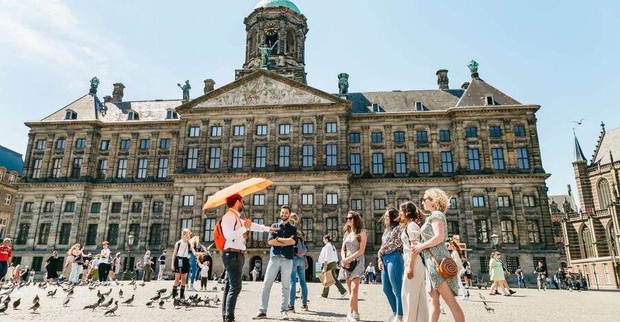 Amsterdam: Historical Highlights Walking Tour with Tasting - Pace, shoes, and weather