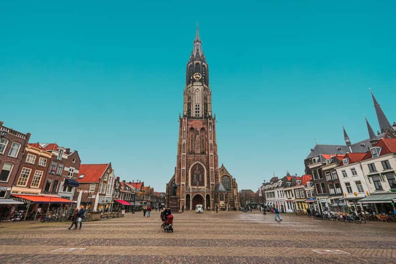 Amsterdam: Kinderdijk, Euromast, Delft and Den Haag Day Tour - Four sides of Holland in 8.5 hours