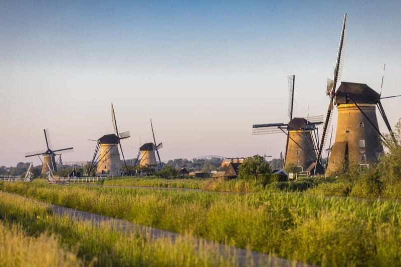 Amsterdam: Kinderdijk, Euromast, Delft and Den Haag Day Tour - Delft’s canals, gables, and medieval towers