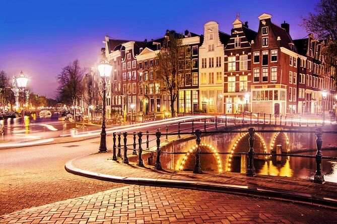 Amsterdam Light Festival Winter Walk with Stroopwafel Workshop - Starting beneath the Royal Palace at Dam Square