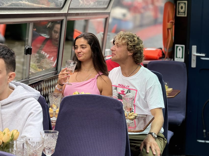 Amsterdam: Luxury Cheese & Wine Canal Cruise - The traditional boat atmosphere