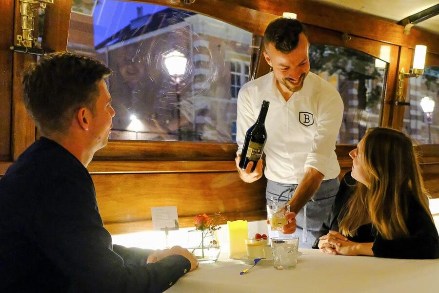 Amsterdam: Luxury Saloon Boat Cruise with 3-Course Dinner - Dinner begins on a classic Amsterdam saloon boat