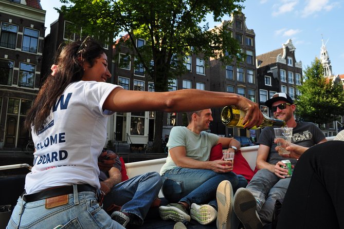 Amsterdam Open Boat Cruise with Live Guide and Two Drinks - The guide is the heart of the experience