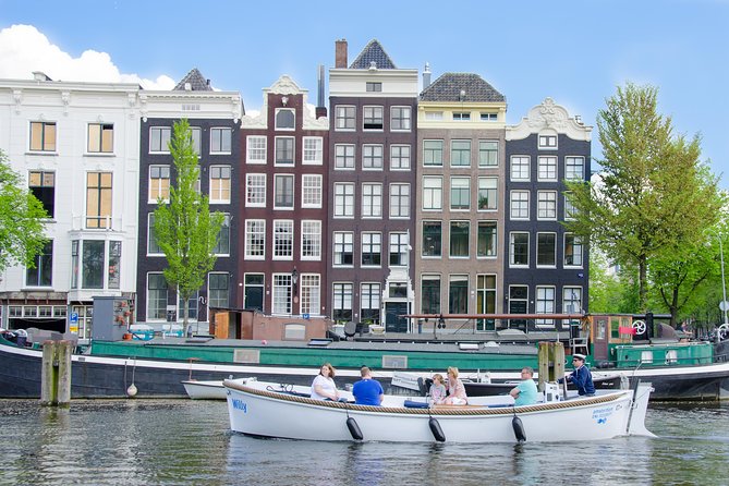 Amsterdam Open Boat Sightseeing Canal Cruise - The Amstel Hotel and the river that shaped the city