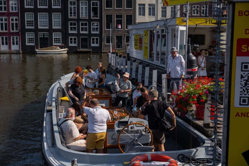 Amsterdam: Open Boat Tour of Canals with Expert Local Guide - Choosing between Damrak, the Rijksmuseum, and Prins Hendrikkade