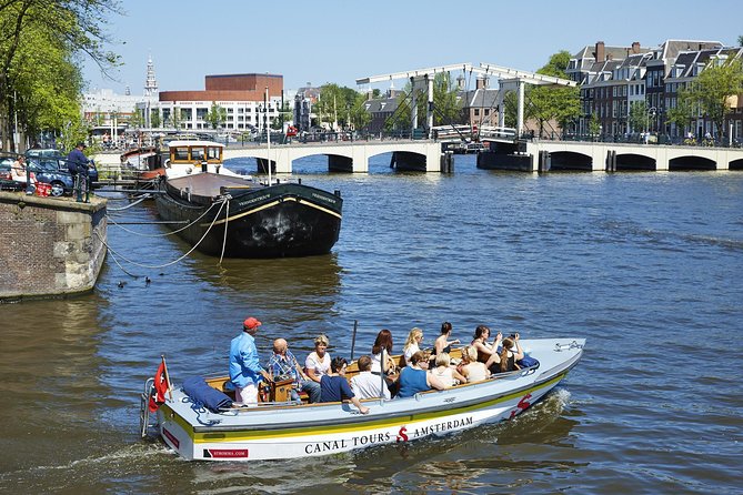 Amsterdam Open Boat Tour with Local Guide - How It Compares With a Larger Covered Cruise