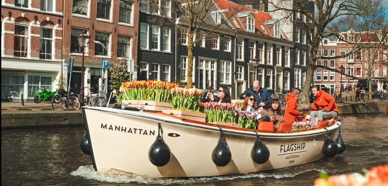 Amsterdam: Premium Tulip Boat Canal Tour - A tulip boat with a very small passenger list
