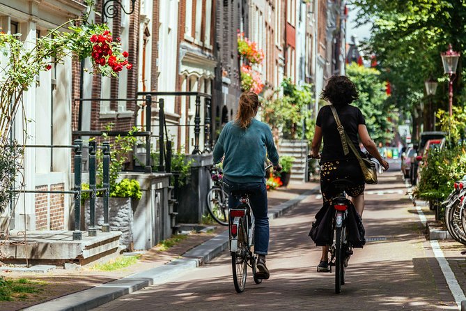Amsterdam PRIVATE Bike Tour With Locals: Bike & Local Snack Included - Jordaan lanes, markets, and changing routes