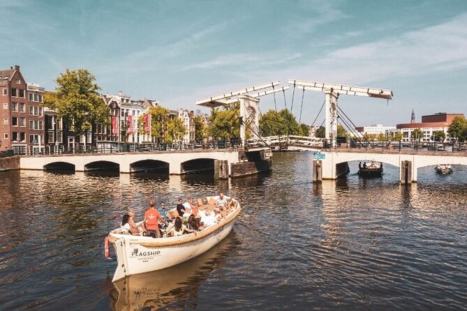 Amsterdam Private Boat Trip with Pizza and Unlimited Drinks - What you see from the water in 90 minutes