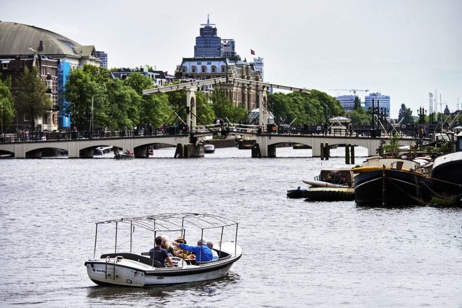 Amsterdam: Private Canal Tour - Weather, access, and meeting point details