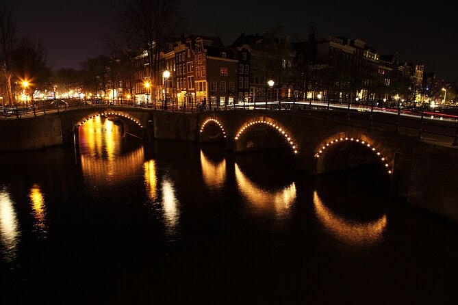 Amsterdam: Private Romantic Evening Canal Cruise + Bubbles/Snacks - Torensluis, the smallest house, and the shortest canal