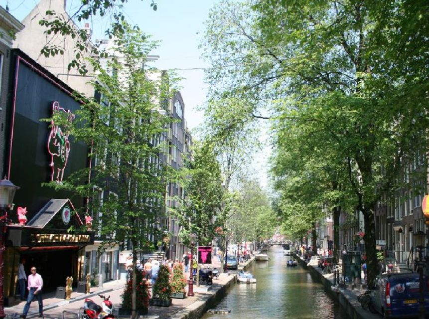 Amsterdam: Red Light District and Coffeeshop tour - Red windows, working women, and the district today