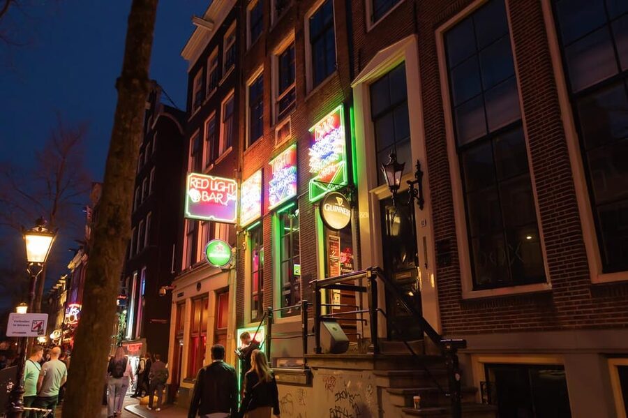 Amsterdam: Red Light Tour Exclusive + Peep Show - Warmoesstraat and Amsterdam’s narrow streets