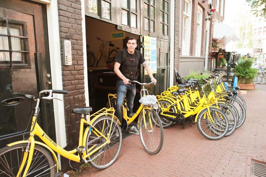 Amsterdam: Relaxed City Highlights Guided Bike Tour - Leidseplein, music, squatting, and city nightlife