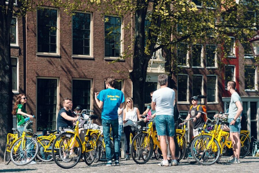 Amsterdam: Relaxed City Highlights Guided Bike Tour - Starting beside Amsterdam’s oldest inhabited square