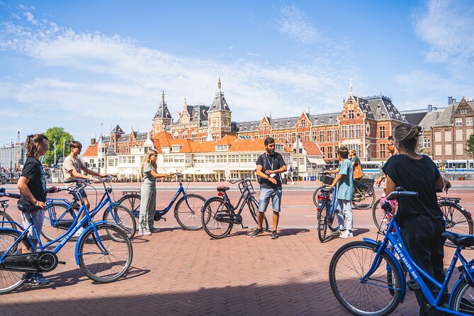 Amsterdam Small-Group Bike Tour With Canal Cruise, Drinks, Cheese - Bridges, canals, and the rhythm of city cycling