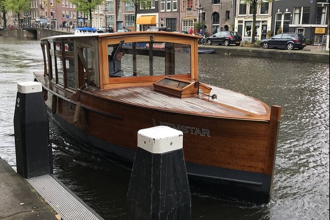 Amsterdam small-group canal cruise in 1920s saloon boat - Reguliersgracht and the city’s bridge views