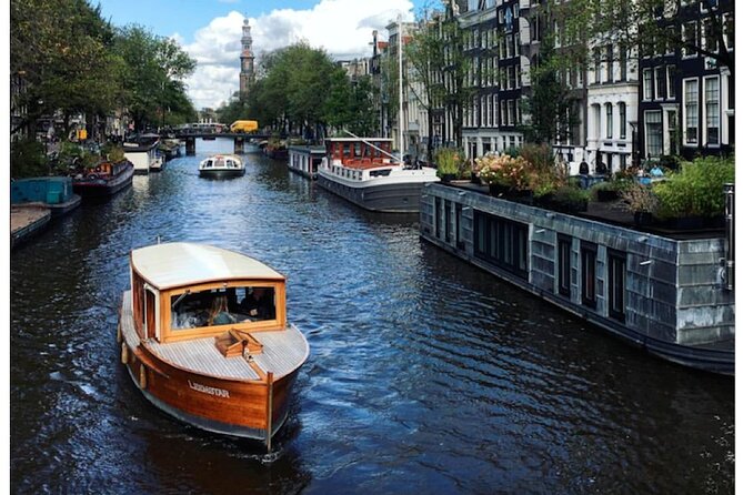 Amsterdam small-group canal cruise in 1920s saloon boat - Drinks, blankets, and the right time to go